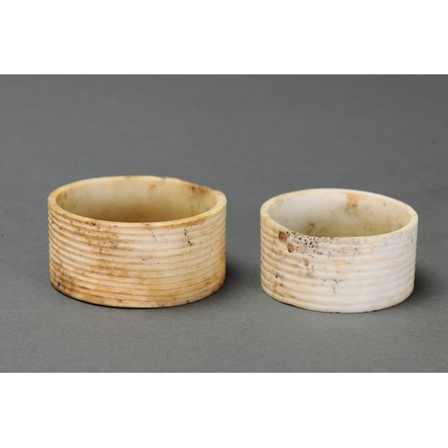 131 - Pair of Fine Reeded Nissan Arm Bands, Tanga Island, New Ireland. Carved and engraved tridacna clam s... 