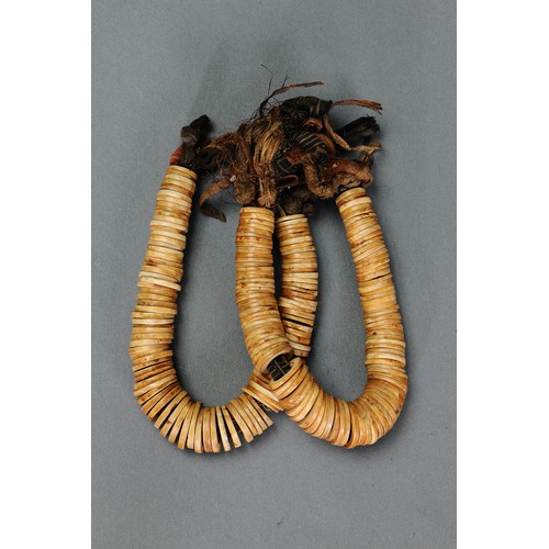 134 - Pair of early leg band Adornments, Malaita, Solomon Islands. Carved conus shell and natural fibre. A... 