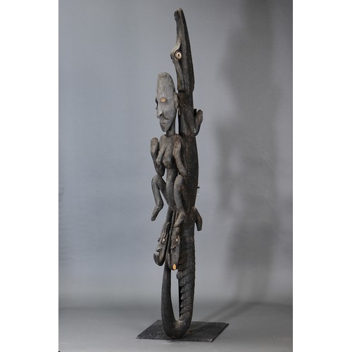 340 - Middle Sepik Female with Crocodile Sexual Figure, Papua New Guinea. Carved and engraved hardwood and... 
