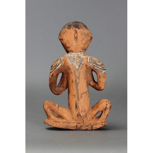 325 - Small Sepik Squatting Figure, Papua New Guinea. Carved and engraved hardwood and natural pigment. Ap... 
