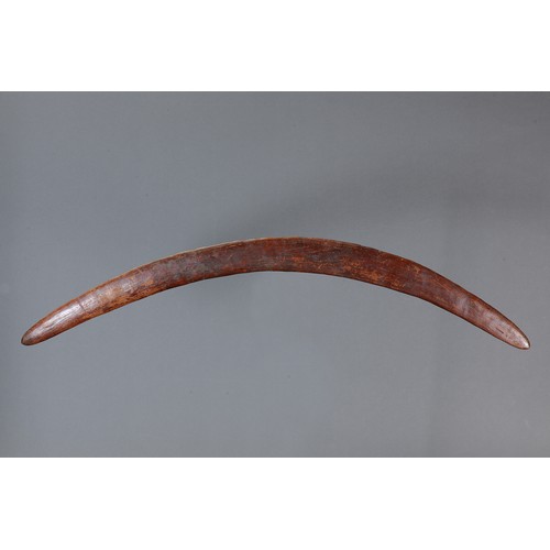 165 - Early Fighting Boomerang, New South Wales. Carved hardwood. Of crescent form, the ribbed surface rep... 