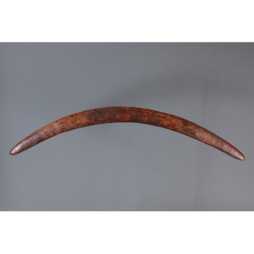 165 - Early Fighting Boomerang, New South Wales. Carved hardwood. Of crescent form, the ribbed surface rep... 