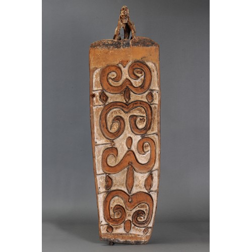 91 - Early Asmat Decorative Shield with Figure atop, Papua New Guinea. Carved and engraved hardwood and n... 