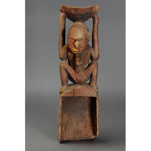 217 - Lower Sepik Canoe Prow carved in form of Mortar with Squatting Female Figure, Papua New Guinea. Carv... 