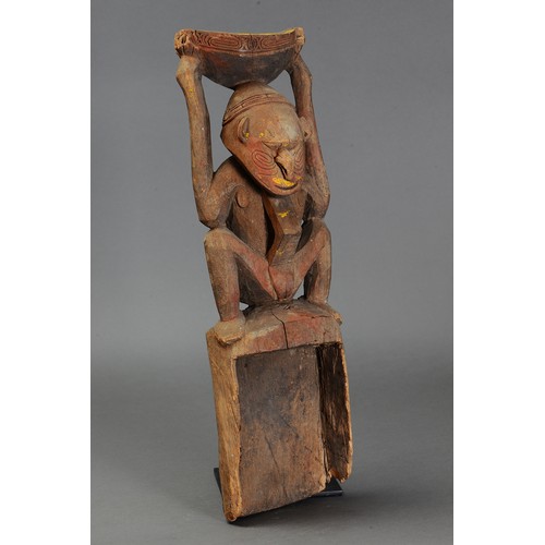 217 - Lower Sepik Canoe Prow carved in form of Mortar with Squatting Female Figure, Papua New Guinea. Carv... 