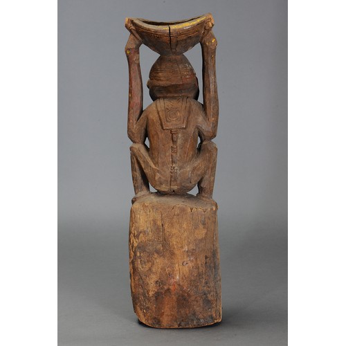 217 - Lower Sepik Canoe Prow carved in form of Mortar with Squatting Female Figure, Papua New Guinea. Carv... 