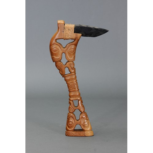 223 - Marquesan Adze with stone blade, Marquesas Islands. Carved hardwood with stone blade attached by nat... 