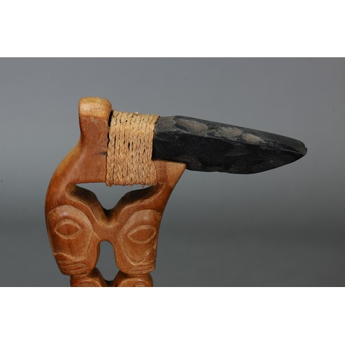 223 - Marquesan Adze with stone blade, Marquesas Islands. Carved hardwood with stone blade attached by nat... 