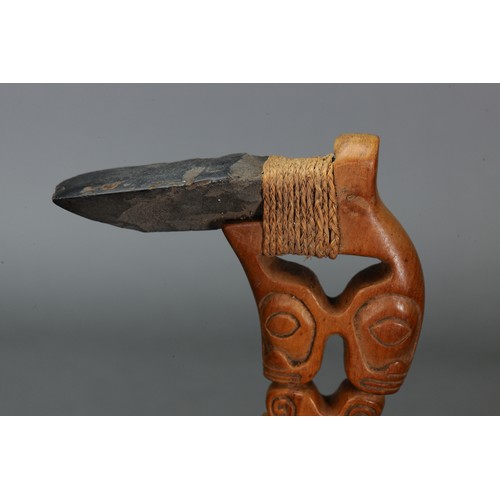 223 - Marquesan Adze with stone blade, Marquesas Islands. Carved hardwood with stone blade attached by nat... 