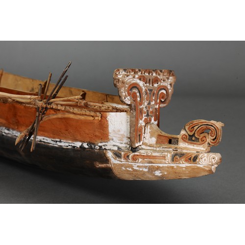 244 - Fine Massim Model Canoe, Trobriand Islands, Papua New Guinea. Carved and engraved wood, fibre and na... 