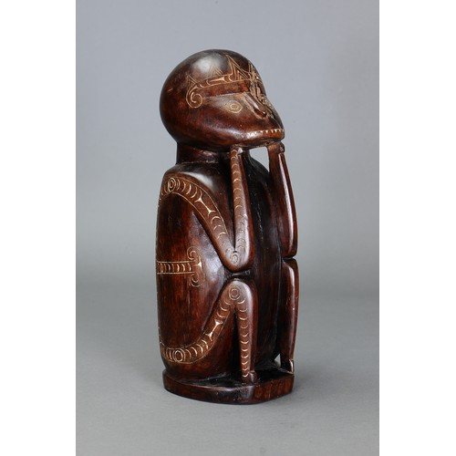 247 - Early Cherubic Massim Figure, Trobriand Islands, Papua New Guinea. Carved and engraved hardwood and ... 