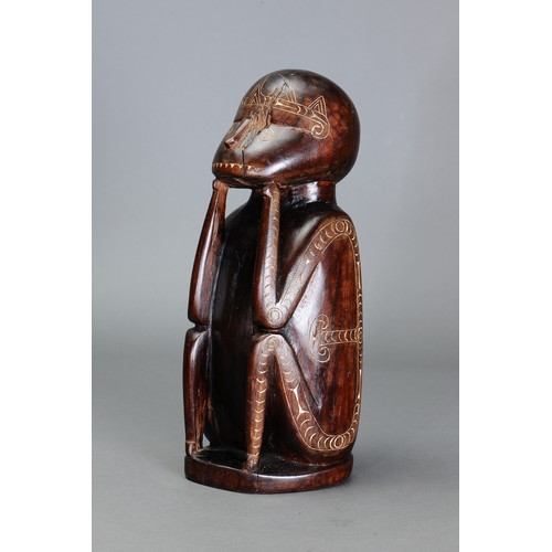 247 - Early Cherubic Massim Figure, Trobriand Islands, Papua New Guinea. Carved and engraved hardwood and ... 