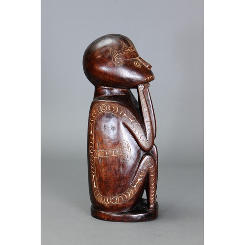 247 - Early Cherubic Massim Figure, Trobriand Islands, Papua New Guinea. Carved and engraved hardwood and ... 