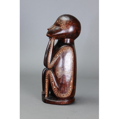 247 - Early Cherubic Massim Figure, Trobriand Islands, Papua New Guinea. Carved and engraved hardwood and ... 