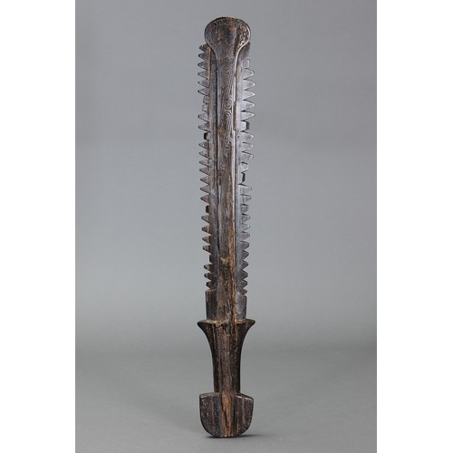 250 - Fine early Massim Saw Tooth Club with Facial Design, Trobriand Islands, Papua new Guinea. Carved and... 