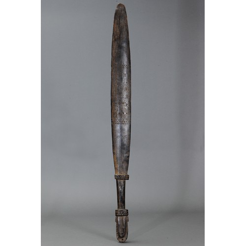 251 - Large Massim Club, Trobriand Islands, Papua New Guinea. Carved and engraved hardwood and natural pig... 