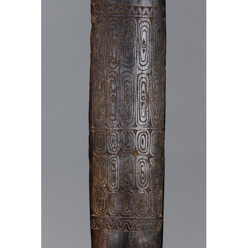 251 - Large Massim Club, Trobriand Islands, Papua New Guinea. Carved and engraved hardwood and natural pig... 