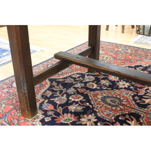 1015 - Long antique style slab top trestle table, champhered square legs, with central stretcher, approx 76... 