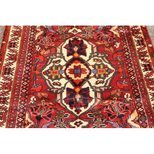 1042 - Handmade Persian wool Bakhtiar carpet, approx 186cm x 308cm