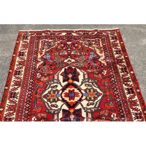 1042 - Handmade Persian wool Bakhtiar carpet, approx 186cm x 308cm