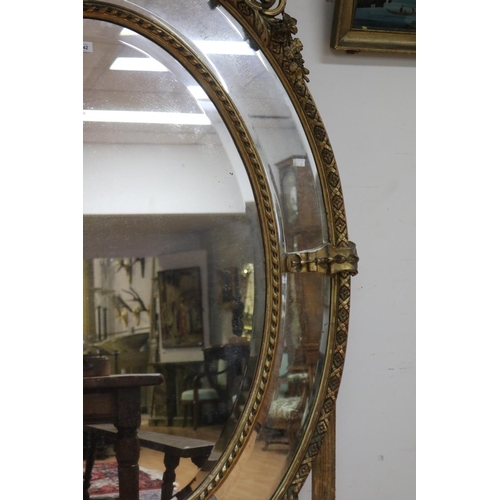 1048 - Impressive antique French gilt salon mirror, sectional design, with elaborate crest flanked by a pai... 