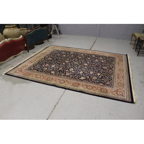 1149 - Large handwoven wool carpet, approx 249cm x 315cm