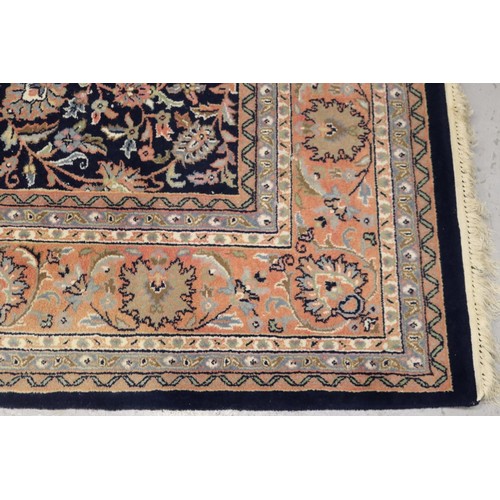 1149 - Large handwoven wool carpet, approx 249cm x 315cm