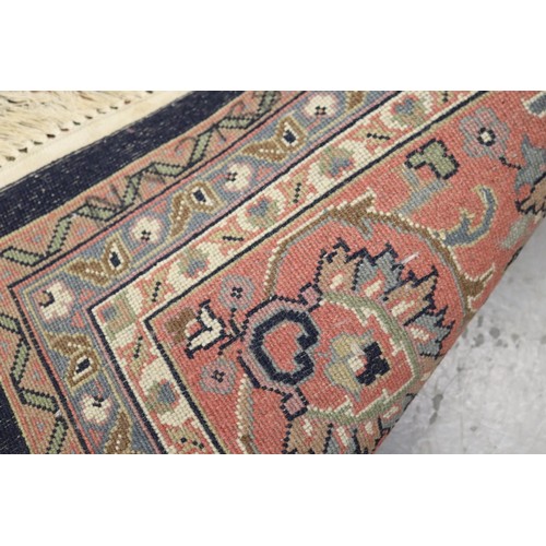 1149 - Large handwoven wool carpet, approx 249cm x 315cm