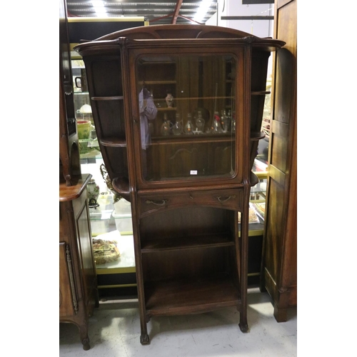 1168 - Antique French Art Nouveau carved walnut cabinet, open shelf base, with single long drawer below a c... 