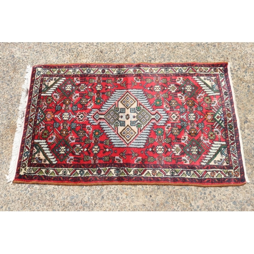 1191 - Persian hand knotted wool carpet, approx 64cm x 104cm