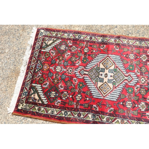 1191 - Persian hand knotted wool carpet, approx 64cm x 104cm