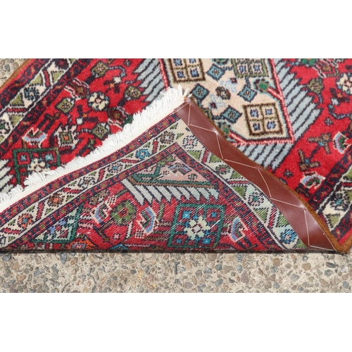 1191 - Persian hand knotted wool carpet, approx 64cm x 104cm