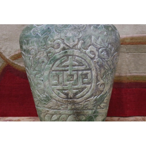 1202 - Chinese archaistic rustic green jade vase, carved in low relief, showing signs of natural cracking, ... 