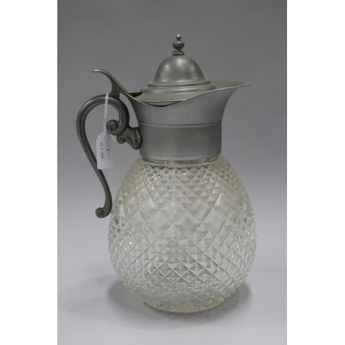 1242 - Lidded pressed glass water jug with strainer, approx 32cm H