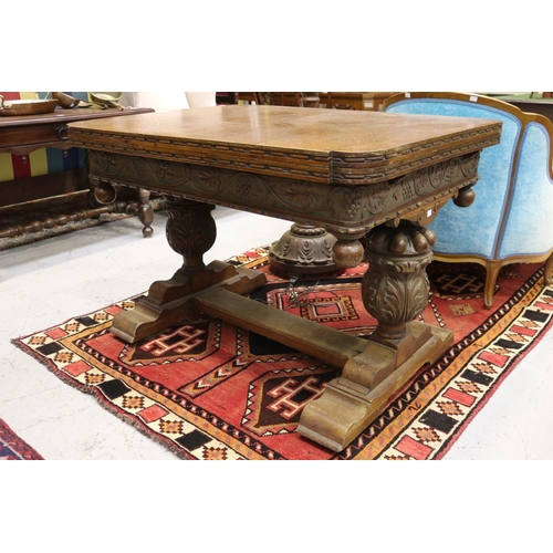 1250 - Antique English oak extension dining table, held with large carved baluster supports, with central f... 