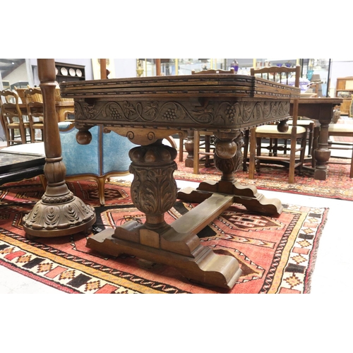 1250 - Antique English oak extension dining table, held with large carved baluster supports, with central f... 