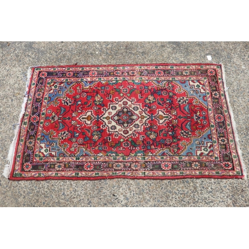 1304 - Eastern woollen carpet, approx 80cm x 138cm