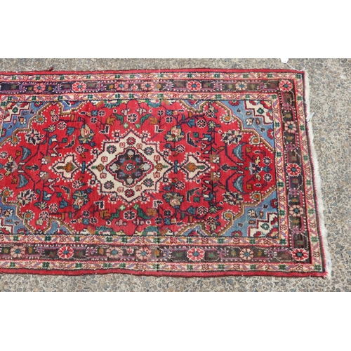 1304 - Eastern woollen carpet, approx 80cm x 138cm