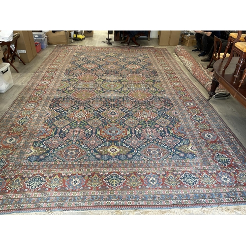 209 - Impressive large semi antique Heriz wool carpet, hand knotted wool, early 20th Century, blue field w... 
