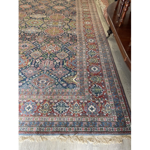 209 - Impressive large semi antique Heriz wool carpet, hand knotted wool, early 20th Century, blue field w... 