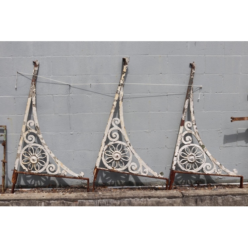 1338 - Set of three antique French wrought iron brackets with a rustic white painted finish, each approx 14... 