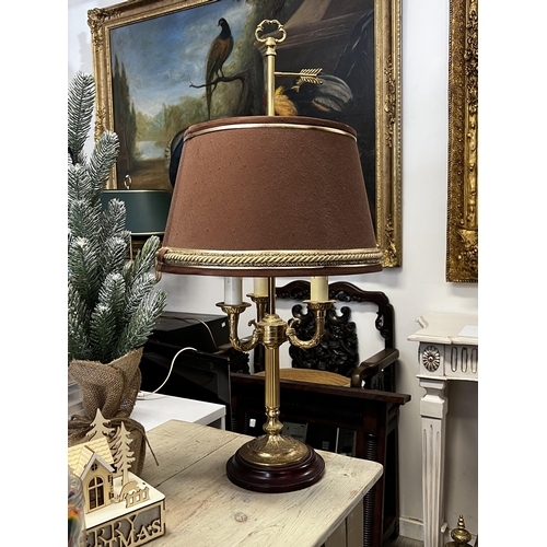 228 - Brass column form three light lamp with brown shade, approx 77cm H