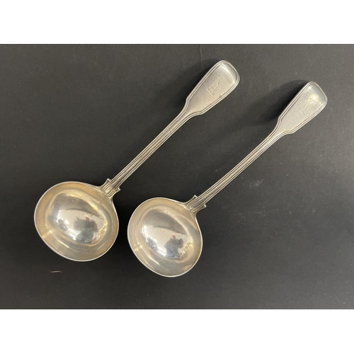 121 - Pair of antique Victorian hallmarked sterling silver fiddle and thread ladles, with crest, London 18... 