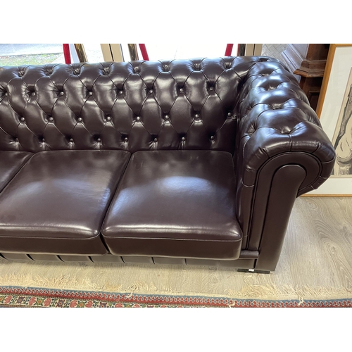 191 - Dark chocolate brown deep buttoned leather three seater Chesterfield, approx 212cm W