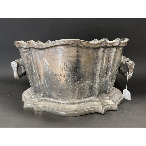 242 - Bollinger Champagne twin handle ice bucket, cast metal, approx 22cm H and 44cm W handle to handle
