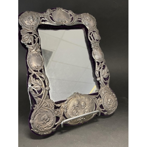 256 - Decorative pierced silvered metal mounted framed mirror, approx 33 cm x 24 cm