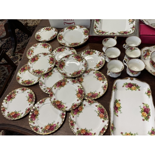 258 - Assortment of Royal Albert Country Roses, to include trays, cups, bread plates, comport etc