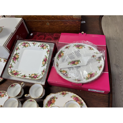 258 - Assortment of Royal Albert Country Roses, to include trays, cups, bread plates, comport etc