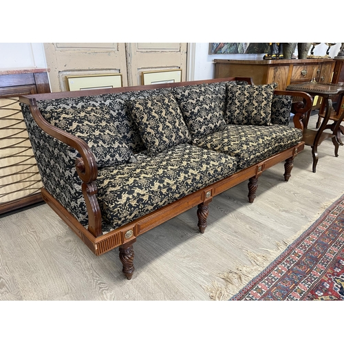 13 - Antique walnut three seater settee, unusual design, with double scroll arm supports, carved applied ... 