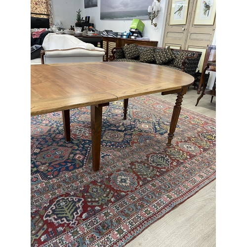 17 - Antique French turned fluted leg extension dining table, with two extra leaves, approx 232 cm long (... 